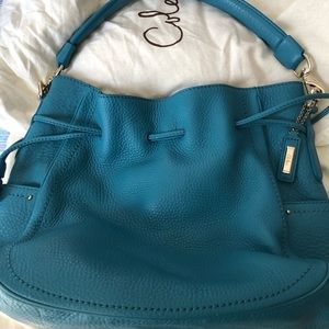 Cole Haan calfskin leather teal drawstring purse.